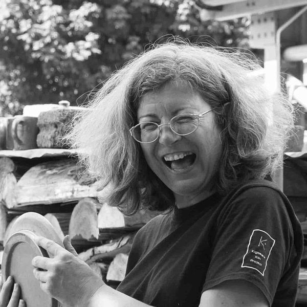 Brigitte Colleaux smiling holding a plate